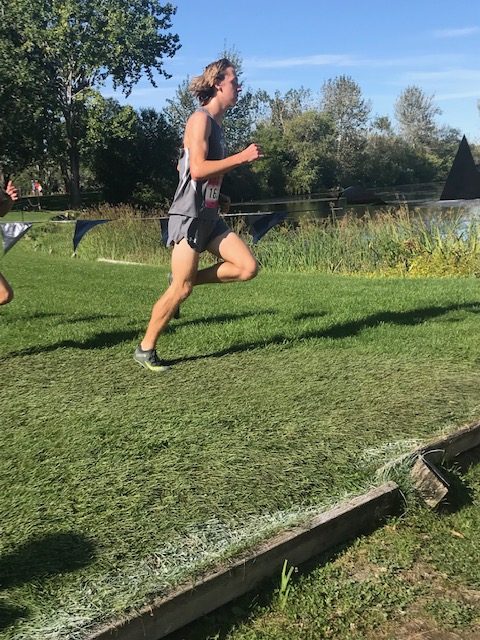 Ryker Holtzen running at the cross country meet.